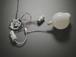 Small vacuum pump motor as an example part; the tester is custom
